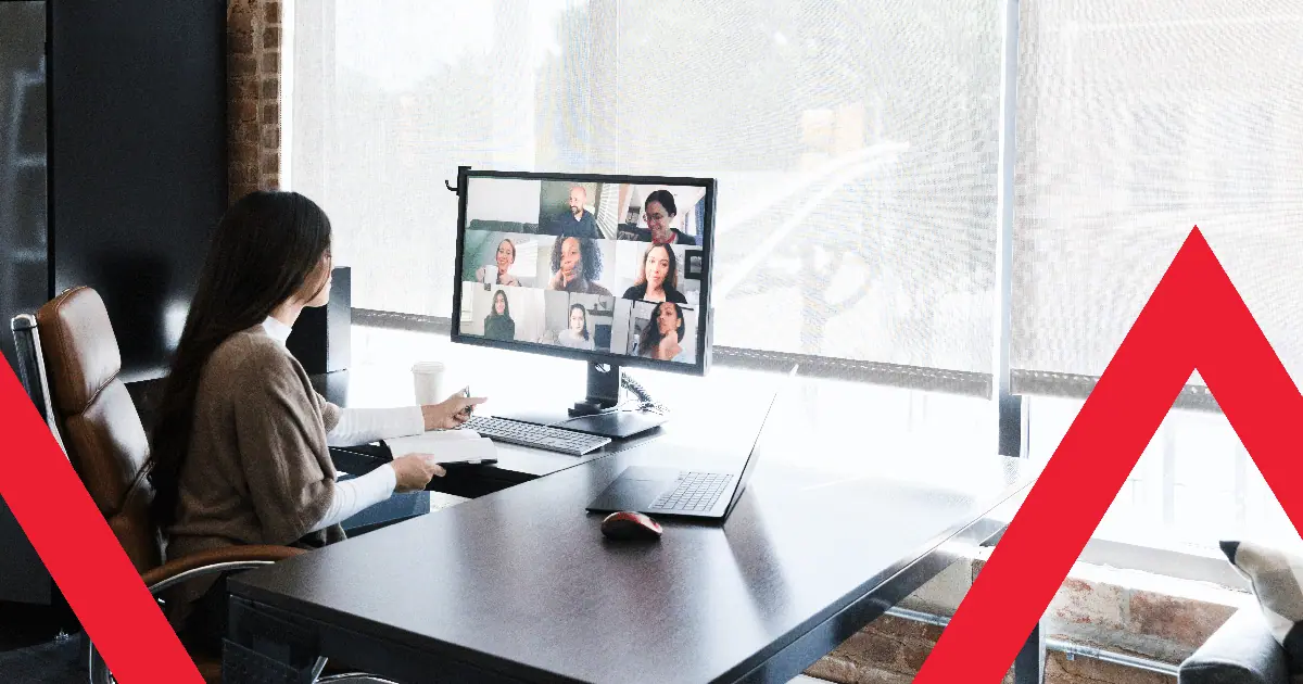 Person on video conference at office desk.